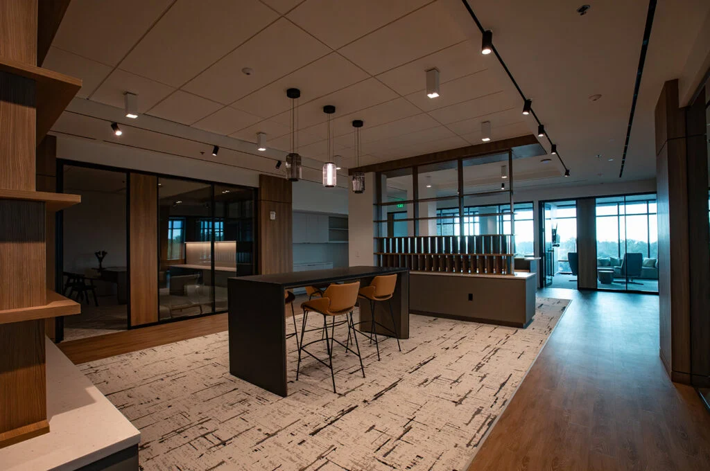 Commercial office with patterned carpet and wood flooring
